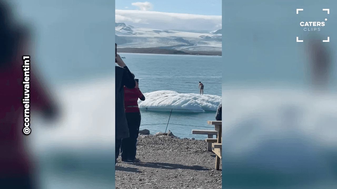 Heart-Stopping Moment Tourist Climbs Floating Iceberg